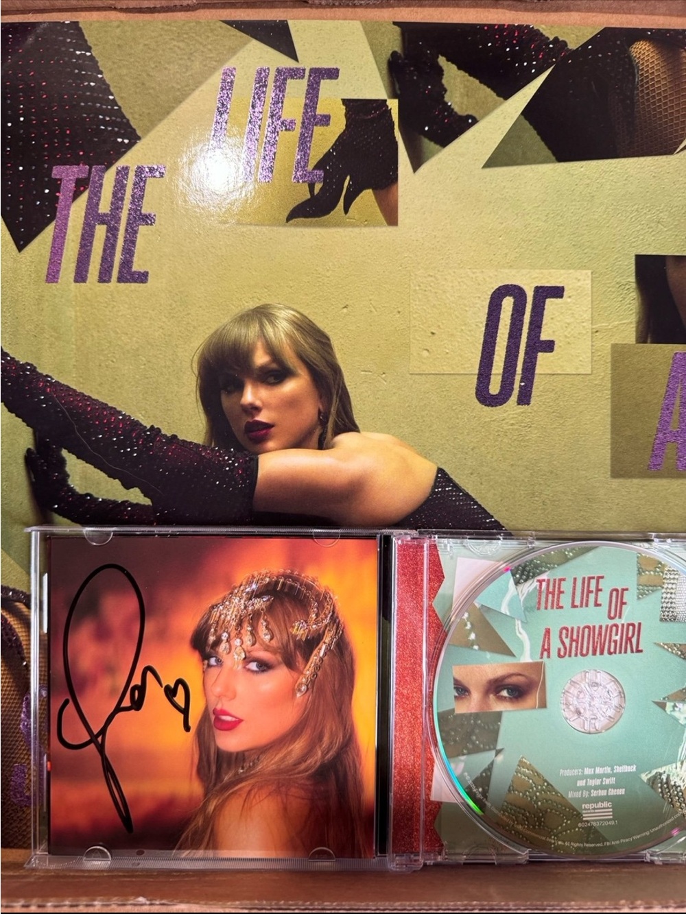 Taylor Swift Autographed TLOAS CD and shiny bug purple vinyl